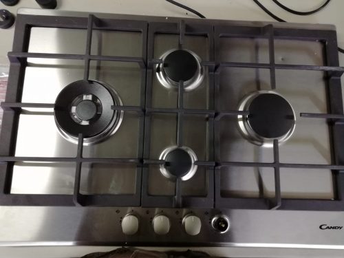 10896 -- 000 (11100) CANDY Piano Cottura CPG74SWGX a Gas 4 Fuochi Gas Colore Acciaio Inox